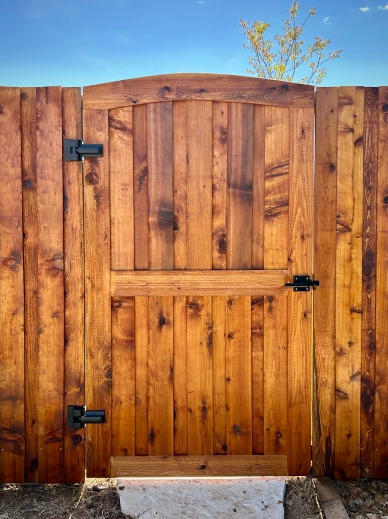 Custom wooden gate and fense with black hardware - Creative Timberworks, Abilene TX