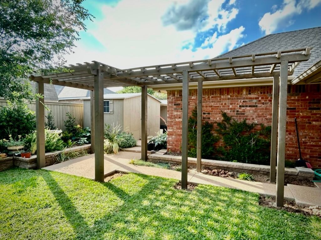 Garden arbor over an Abilene backyard walkway