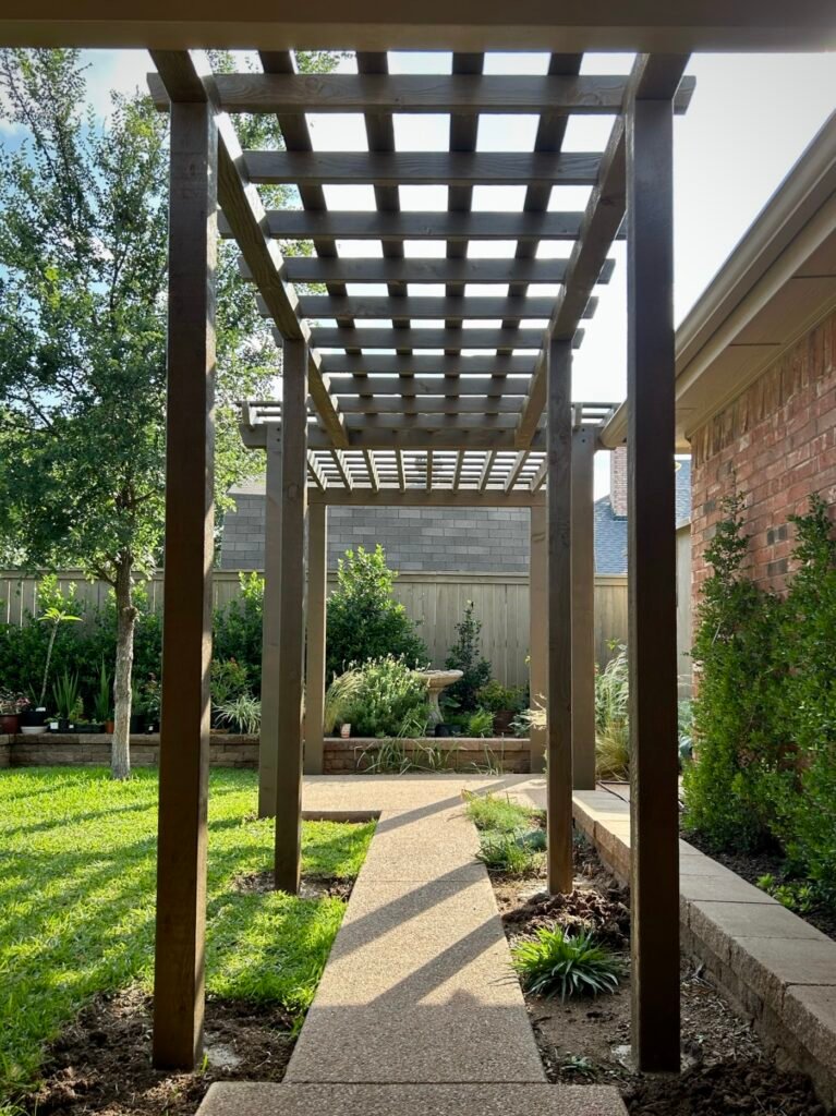 Custom garden arbor over an Abilene backyard walkway