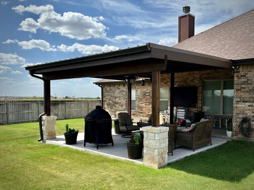 Custom Patio cover, gutters, roof featuring stonework - Creative Timberworks, Abilene TX