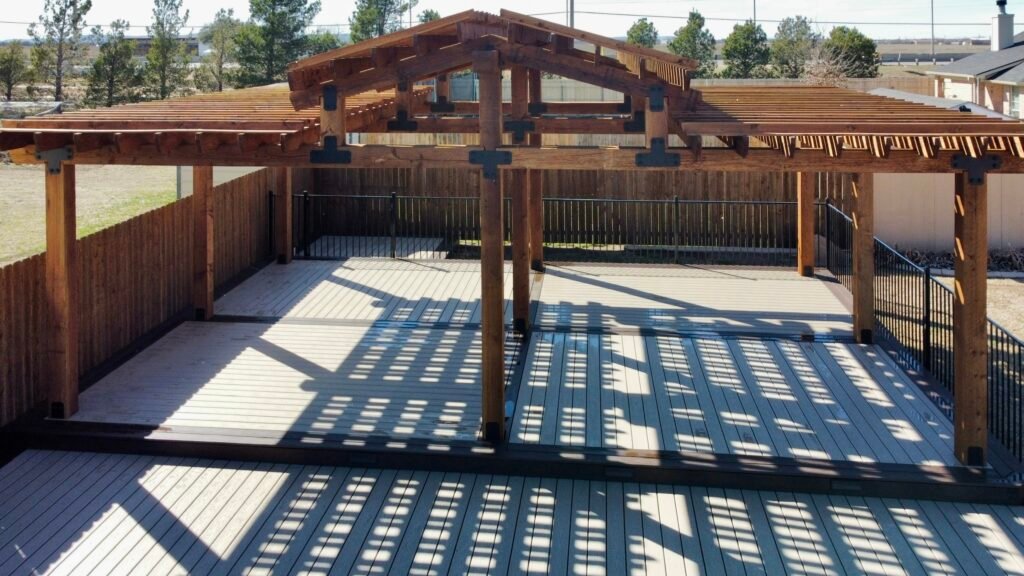 Finished Custom Massive swimming pool deck, rail fencing, and cedar pergola - Creative Timberworks Abilene TX