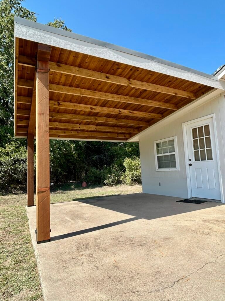 Cedar back patio cover with wood sheeting attached to home